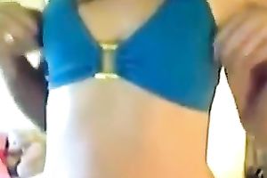 Attractive brunette hair legal age teenager looks beautiful in blue bikini