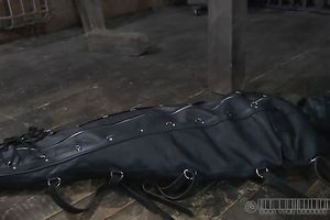 This leather sleep sack is very taut on slave's body