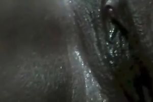 Super dark hottie rubs her juicy and itchy fanny by her fingers