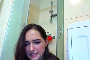 Hot legal age teenager is engulfing and riding her suction cup marital-device in the shower