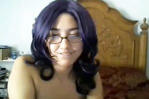 Cute black purple haired cutie in glasses positions topless on livecam