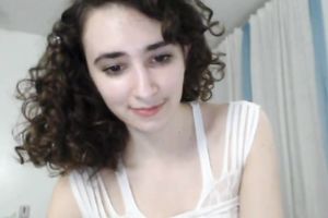 Curly haired appetizing sweetheart showed off her mesmerizing breasts