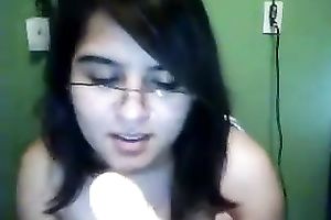 Cute nerdy dark brown copulates herself with a sex toy on livecam