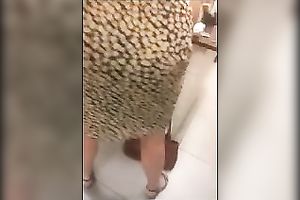 Super sexy woman in constricted suit has an ass to be proud of