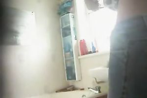 Voyeur scene with my GF flashing her naked arse in the washroom