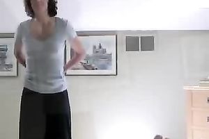 Sexy brunette wife strip dances to the music for husband friends