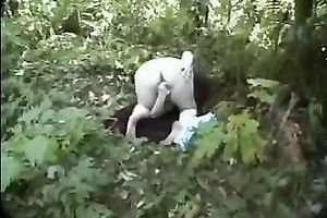 Voracious light-haired stumpet fingers her twat in the woods