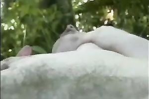 Voracious light-haired stumpet fingers her twat in the woods