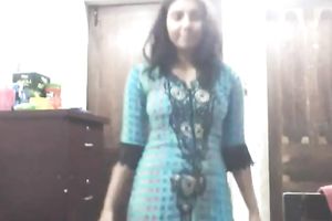 Cute lengthy haired Indian gal shows off in her bright saris