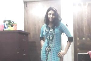 Cute lengthy haired Indian gal shows off in her bright saris