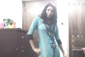 Cute lengthy haired Indian gal shows off in her bright saris