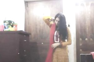 Cute lengthy haired Indian gal shows off in her bright saris