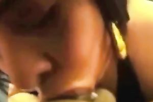 Dark haired voluptuous horny nympho in dark reservoir top gives BJ