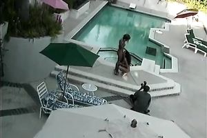Large dark rod for 2 perverted and lascivious honeys in the swimming pool