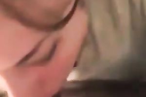 Curly secretary of my buddy works on his large chubby prick with pleasure