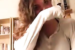 Curly secretary of my buddy works on his large chubby prick with pleasure