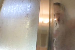 Delightful and breasty white girl showering in front of camera