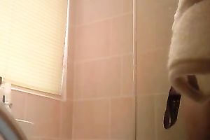 Hidden camera filming slender flatmate in the bath