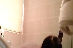 Hidden camera filming slender flatmate in the bath