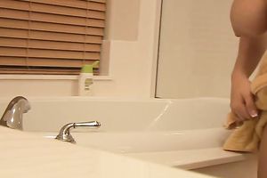 Brunette teen skank flashes bawdy cleft during the time that washing in the bathtub