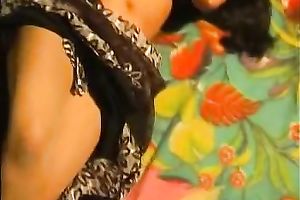 Chubby Indian brunette jams wobblers and rubs love button on the bunk couch