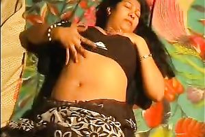 Chubby Indian brunette jams wobblers and rubs love button on the bunk couch