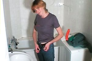 Redhead Russian milf with large saggy boobies washes and masturbates in the washroom