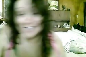 Tattooed bosomy brunette hair smiles during the time that masturbating