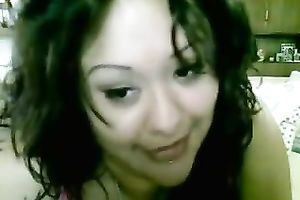Tattooed bosomy brunette hair smiles during the time that masturbating