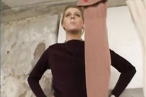Sassy golden-haired female stiffs and puts on nylon hose