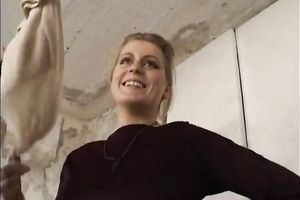 Sassy golden-haired female stiffs and puts on nylon hose