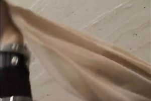 Sassy golden-haired female stiffs and puts on nylon hose