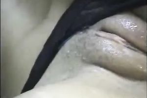 Sexy black haired dilettante girlie with rounded bum tickles her moist cunt