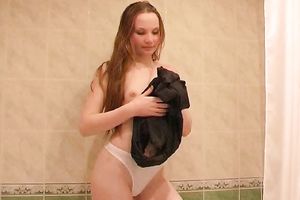 Redhead magnificent juvenile babe disrobes in the bathtub and piddles