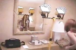 Young redhead GF washes her face after taking a giant facial