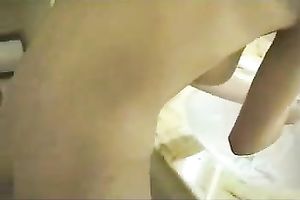 Young redhead GF washes her face after taking a giant facial