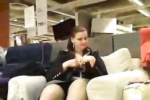 My crazy girlfriend plays with her twat in a furniture store