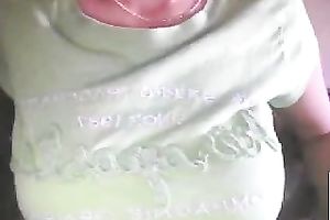 horny web camera bitch pulled up her green T-shirt to show off her big boobies