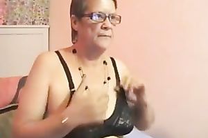 Mature short haired black cock slut on livecam strips and masturbates