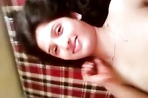 Beautiful Indian housewife lying on the bed bare and getting filmed