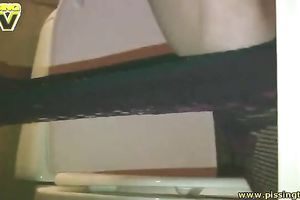 Dirty-minded brunette Klavdia pulls down pantyhose and pees in crapper