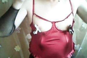 Fat golden-haired mommy pins her pink teats with metal pegs