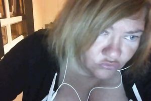 Ugly large boobed doxy showing her bust on cam session