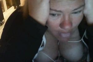 Ugly large boobed doxy showing her bust on cam session