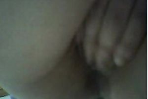 Pretty wonderful natural Asian brunette gets busy with fingering her pleasant snatch