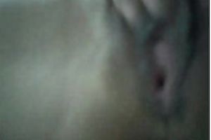 Pretty wonderful natural Asian brunette gets busy with fingering her pleasant snatch