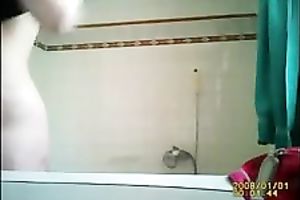 My large boobed GF feels comfortable taking a bathroom in front of a camera