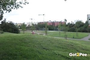 Adorable blond sweetheart walks outdoors in the late summer