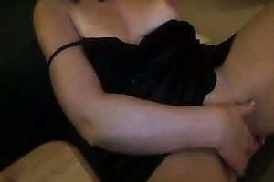 Tempting black haired dominatrix-bitch toying her love tunnel passionately