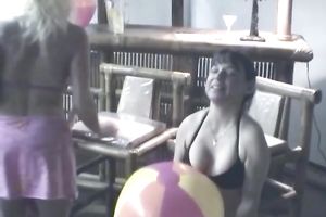 Three hottest beach sweethearts sit at the bar and entice bartender